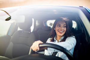 Young woman driving © Shutterstock